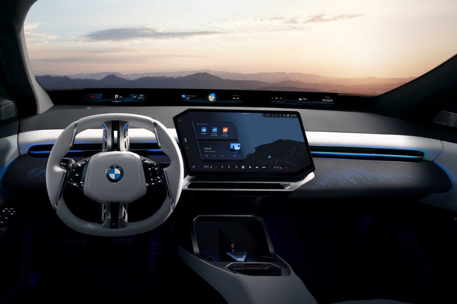 Poste de conduite du BMW iX3 avec la bande d'affichage Panoramic Vision et l'écran central